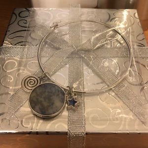Precious stone on a silver bangle